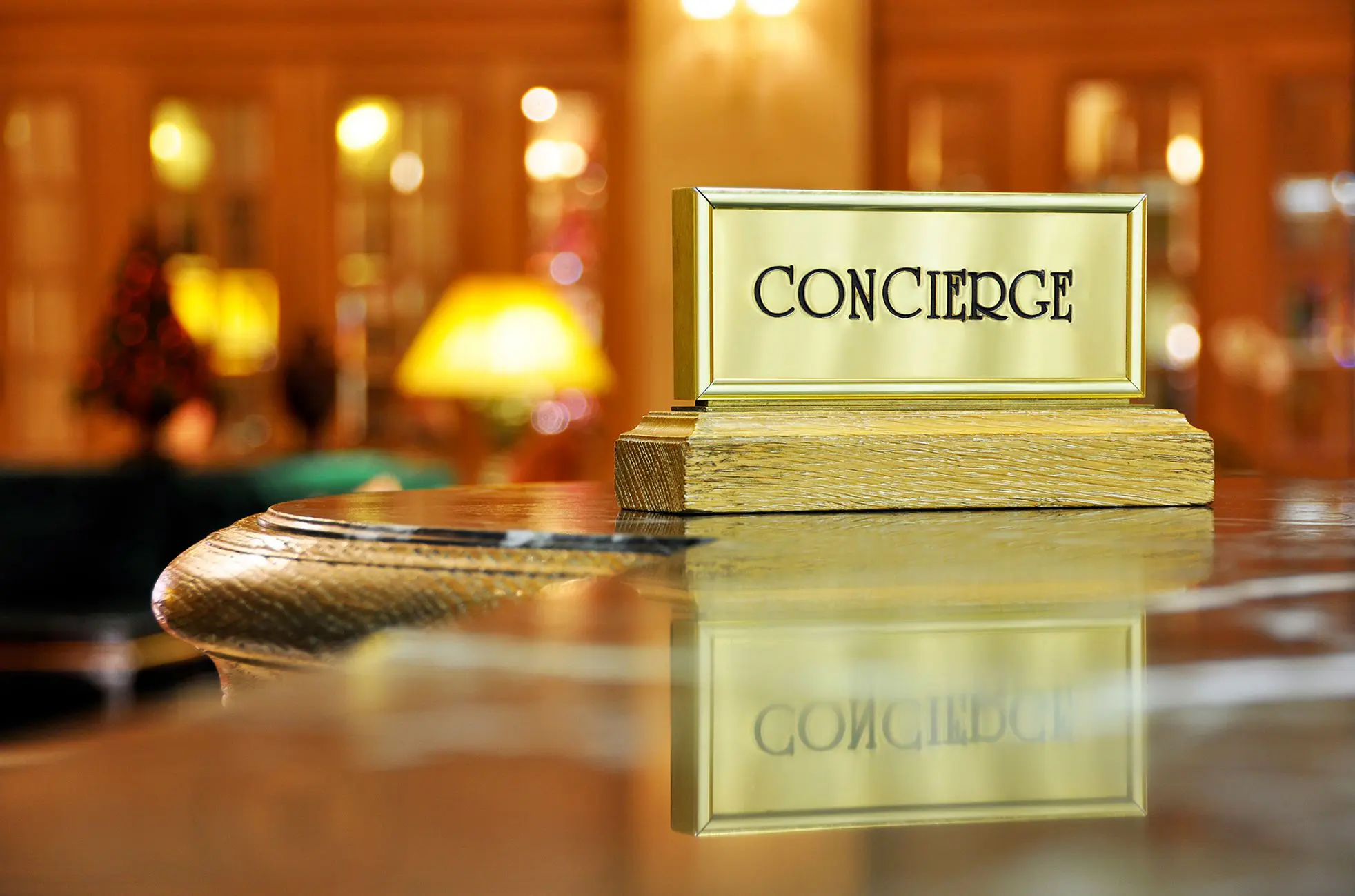 Concierge desk sign with blurred background.