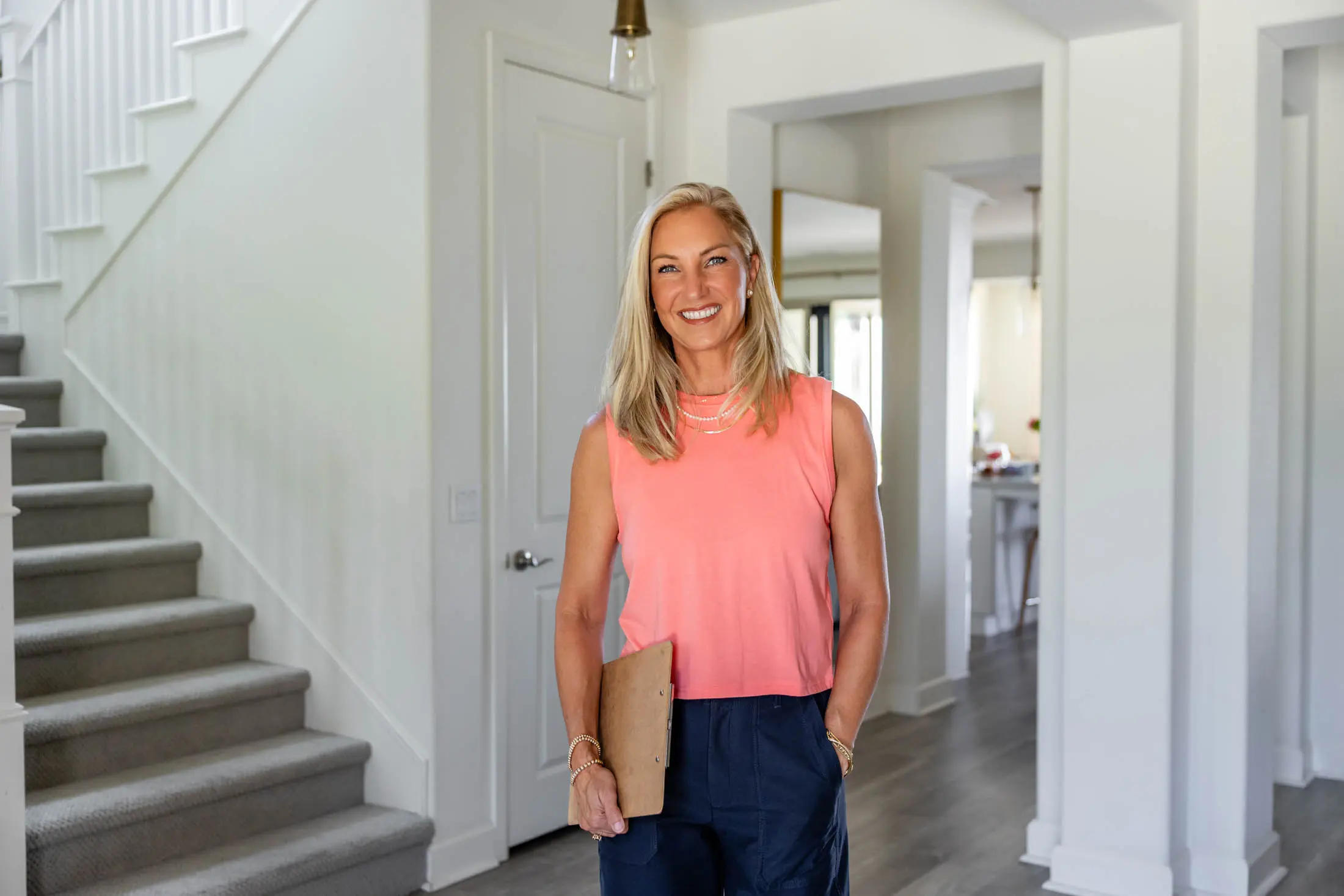 Woman smiling in modern home interior.