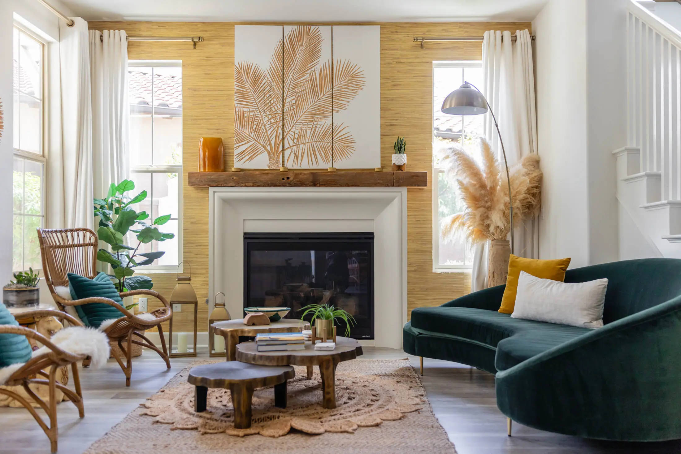 Cozy living room with fireplace and plants.
